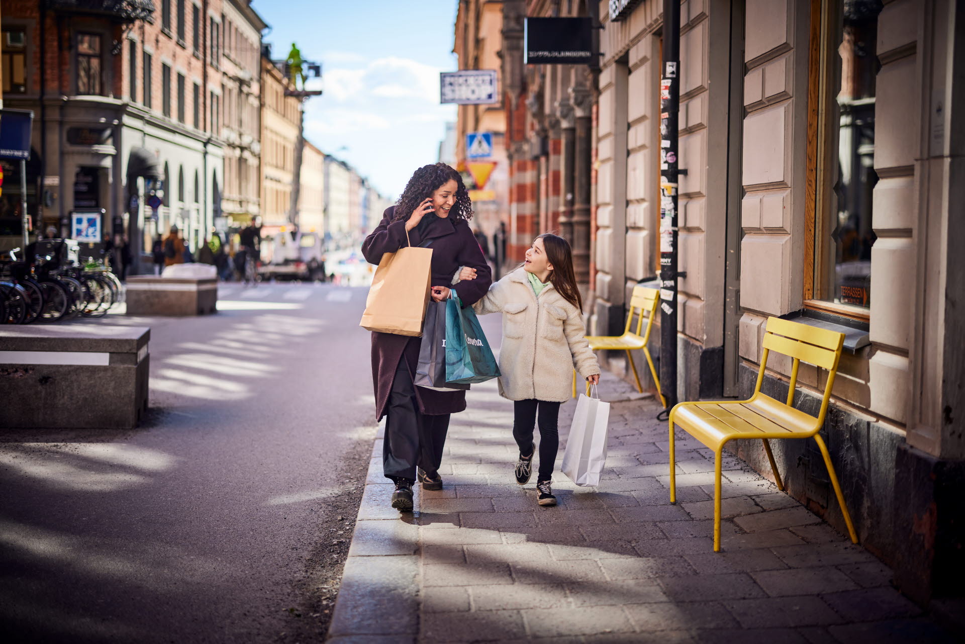 Woman and Child walking in the city. Consumer experience created by ITAB