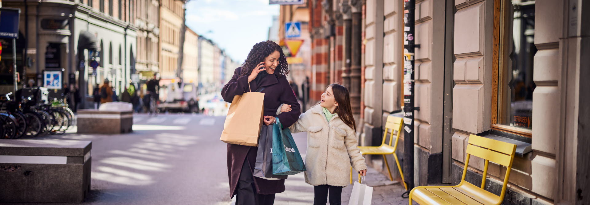 Woman and Child walking in the city. Consumer experience created by ITAB